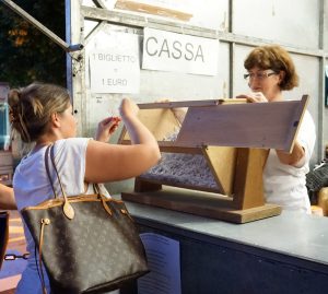 Lady picking a ticket at the pesca