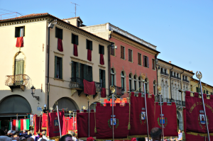 Confraternity passing by with red banners